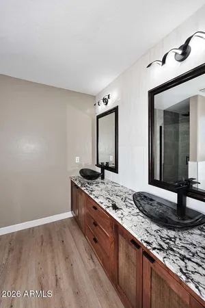 a view of a livingroom with furniture nad wooden floor