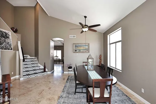 a dining room with furniture and window