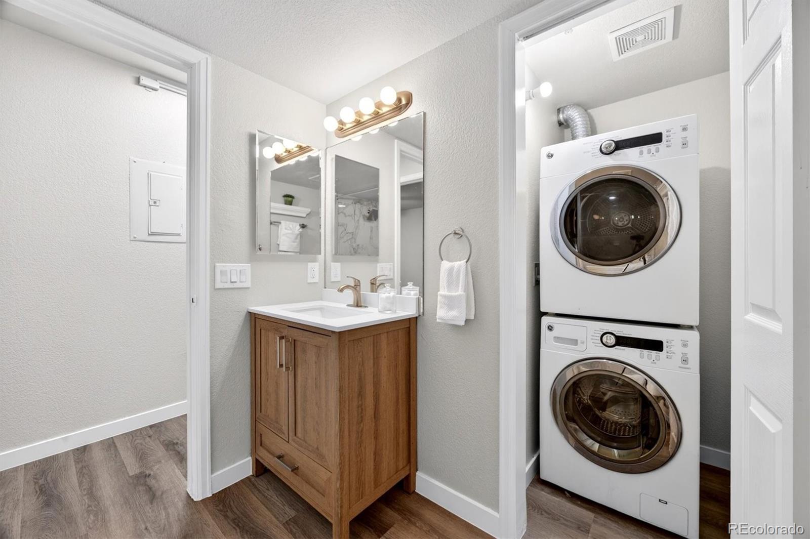 5021 Garrison Street, Unit 103A Wheat Ridge, CO 80033 - Photo 13 of 19 a utility room with sink dryer and washer