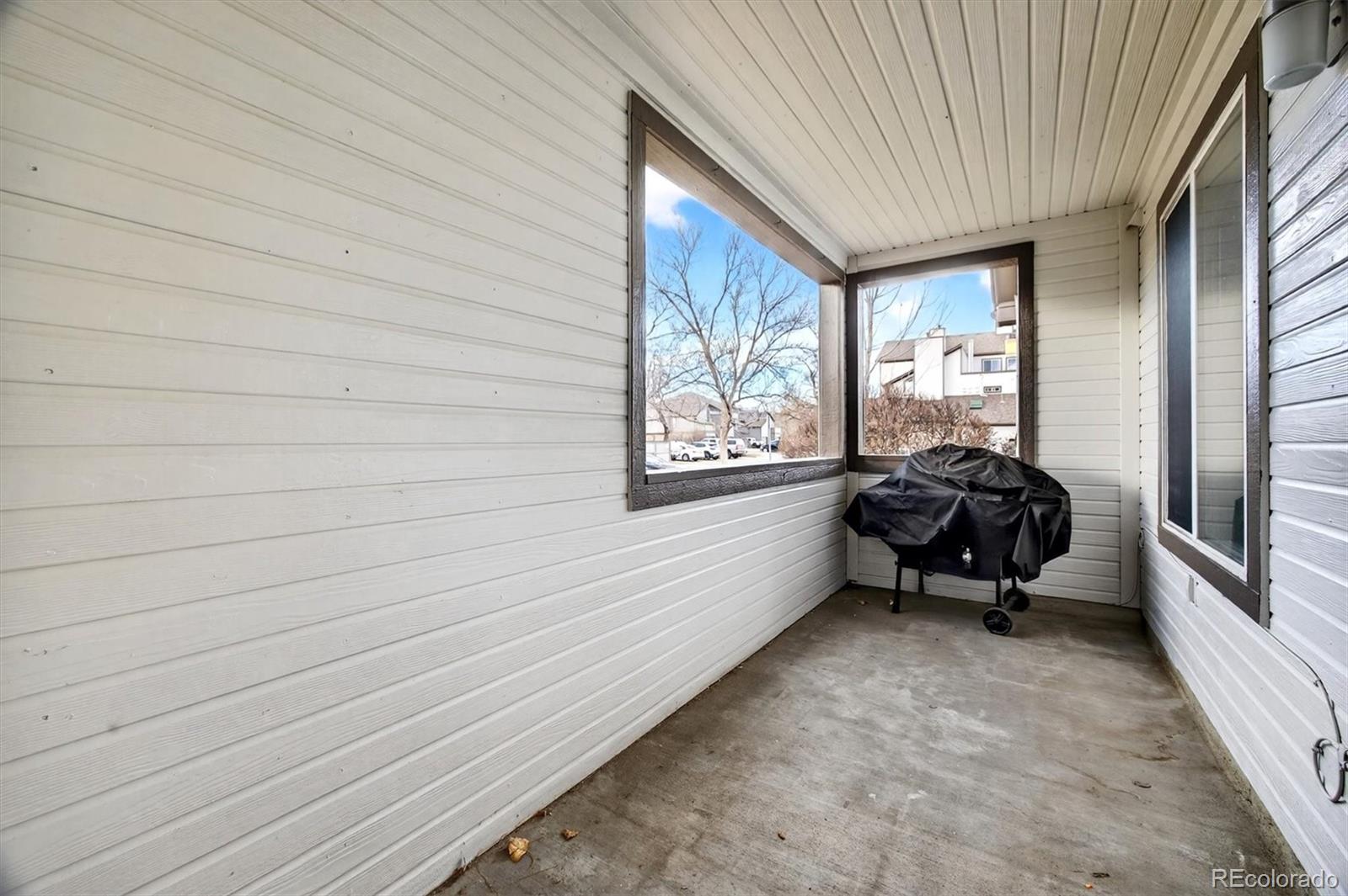 5021 Garrison Street, Unit 103A Wheat Ridge, CO 80033 - Photo 17 of 19 a house with car parked