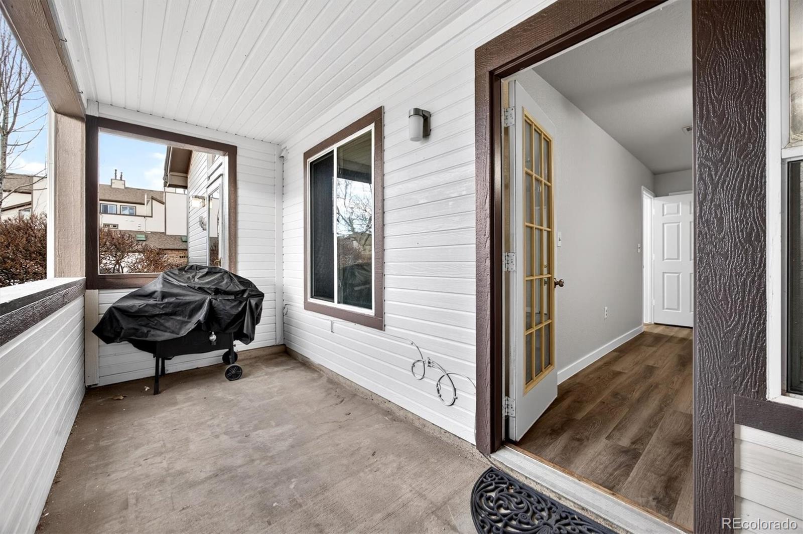 5021 Garrison Street, Unit 103A Wheat Ridge, CO 80033 - Photo 18 of 19 a view of livingroom with furniture and windows