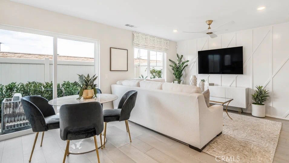 7498 Olive Grv Street Riverside, CA 92507 - Photo 4 of 14 a living room with furniture and a flat screen tv