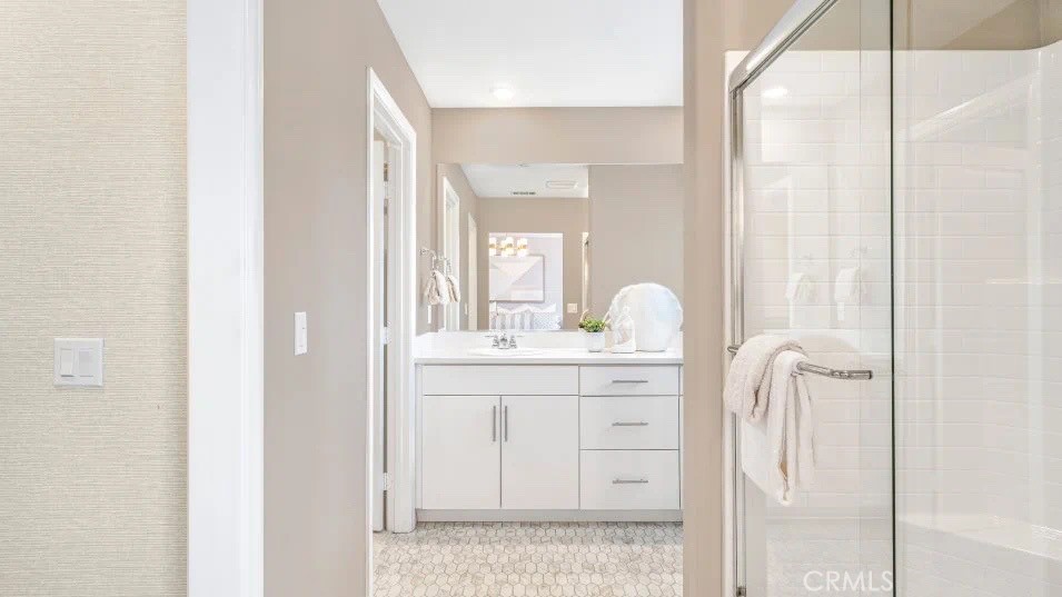 7498 Olive Grv Street Riverside, CA 92507 - Photo 8 of 14 a bathroom with a granite countertop sink vanity and mirror