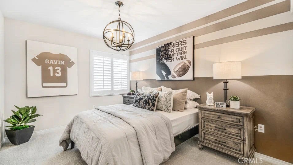 7498 Olive Grv Street Riverside, CA 92507 - Photo 9 of 14 a bedroom with bed and a window