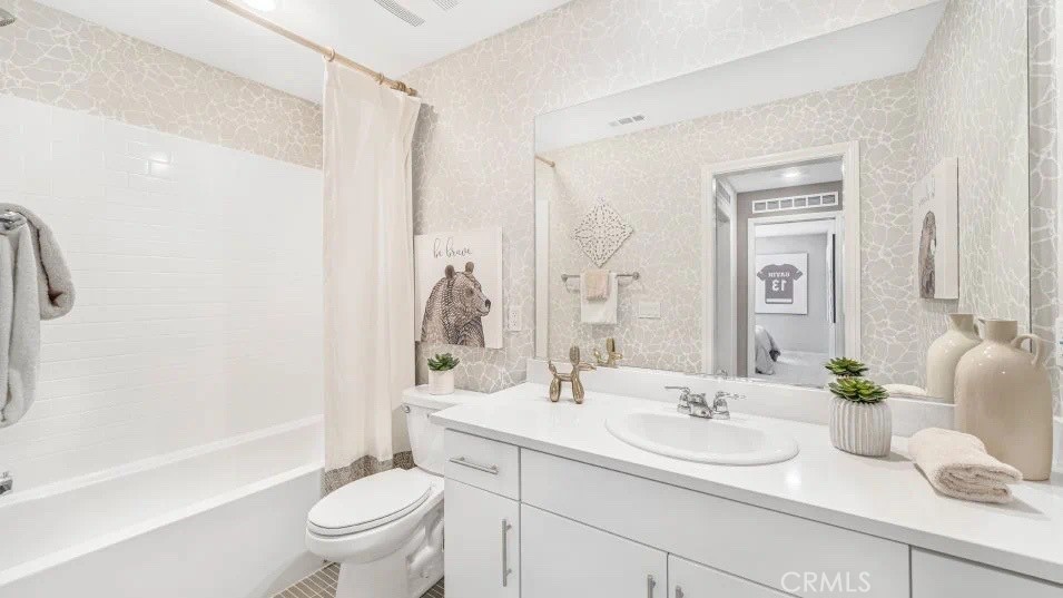 7498 Olive Grv Street Riverside, CA 92507 - Photo 10 of 14 a bathroom with a sink toilet and shower