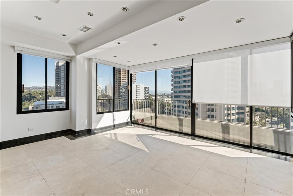 10501 Wilshire Boulevard, Unit 1103 Los Angeles, CA 90024 - Photo 17 of 34 a view of a big room with windows and balcony