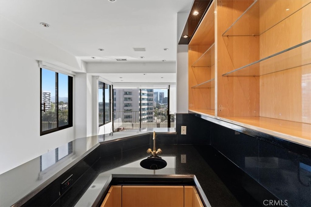 10501 Wilshire Boulevard, Unit 1103 Los Angeles, CA 90024 - Photo 10 of 34 a kitchen with a sink and a window