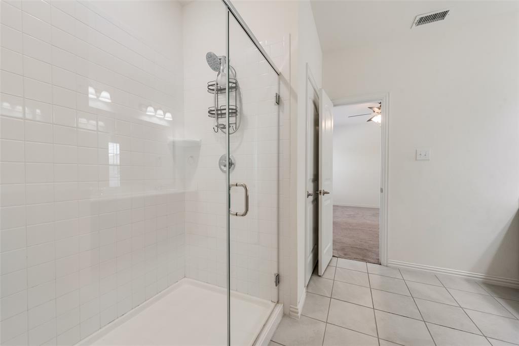 4517 Raleigh Dalton Road Dallas, TX 75227 - Photo 13 of 20 a bathroom with a shower and a glass door