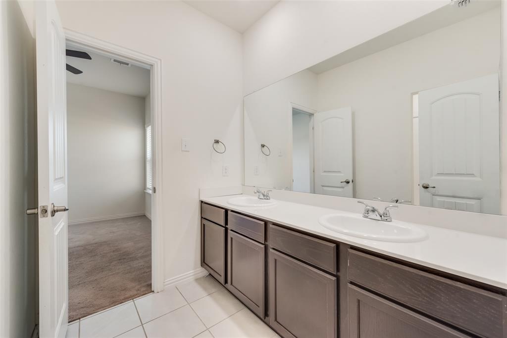 4517 Raleigh Dalton Road Dallas, TX 75227 - Photo 16 of 20 a bathroom with a sink and a mirror