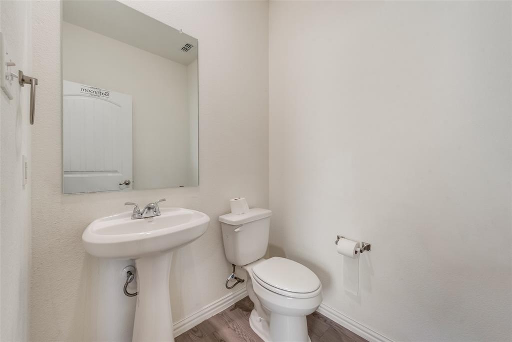 4517 Raleigh Dalton Road Dallas, TX 75227 - Photo 17 of 20 a bathroom with a sink toilet and a mirror