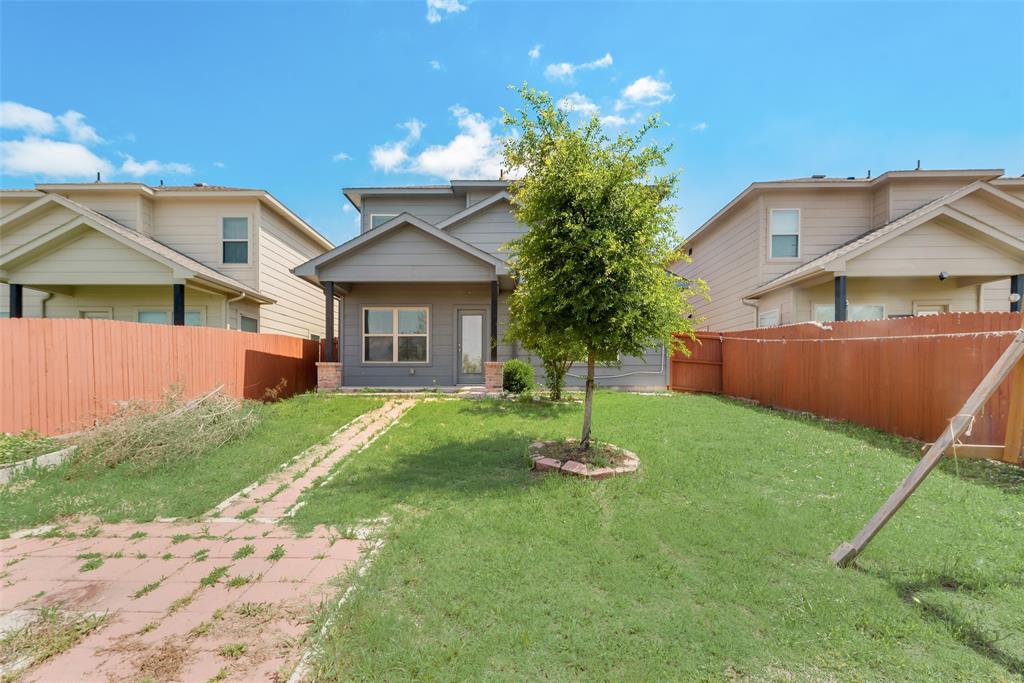 4517 Raleigh Dalton Road Dallas, TX 75227 - Photo 20 of 20 a front view of a house with a garden