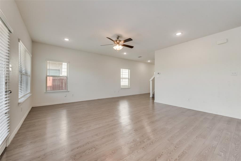 4517 Raleigh Dalton Road Dallas, TX 75227 - Photo 5 of 20 a view of an empty room with a window and a kitchen