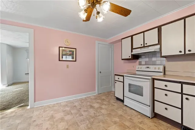 a kitchen with stainless steel appliances granite countertop a stove and a sink
