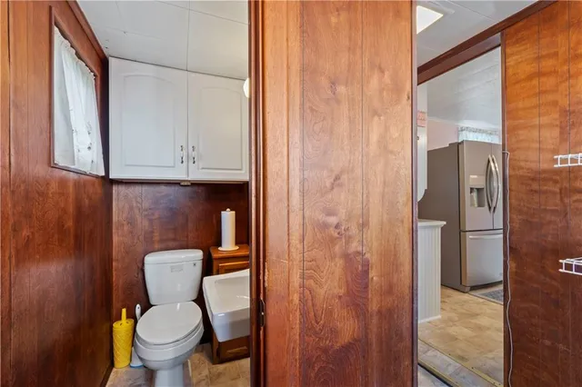 a bathroom with a toilet and a sink