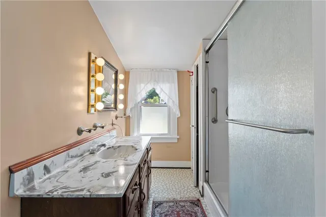 a dining room with furniture and a window