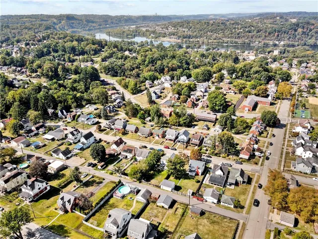 an aerial view of residential houses with outdoor space