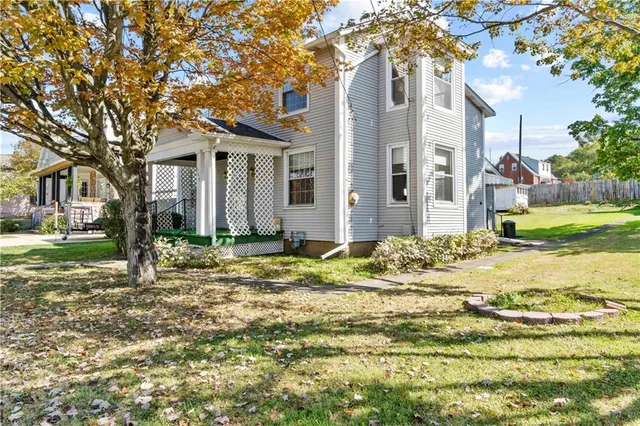 a front view of a house with garden