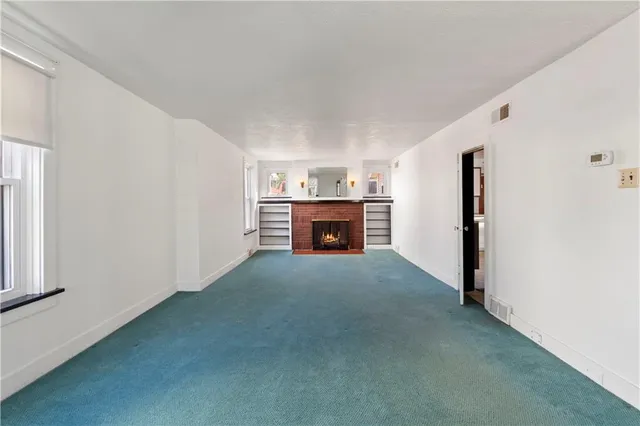 a view of a livingroom with a fireplace