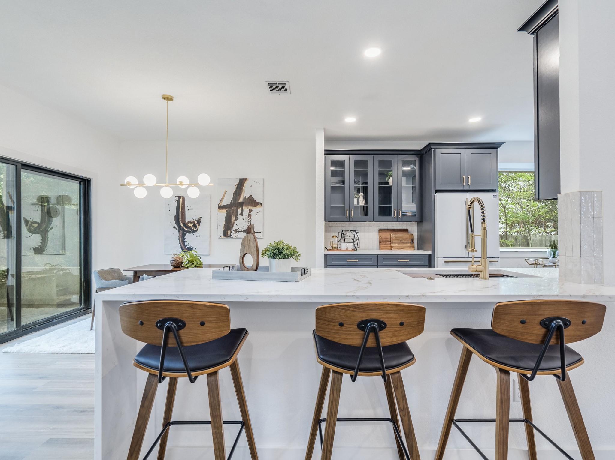 11810 Bittern Hollow Austin, TX 78758 - Photo 6 of 22 a table and chairs in a kitchen