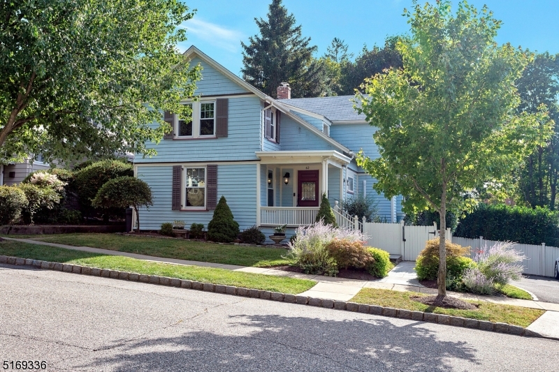 62 Crane Street Caldwell, NJ 07006 - Photo 1 of 28 a front view of a house with a yard and garage