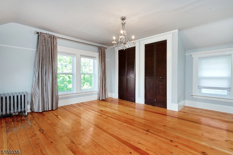 62 Crane Street Caldwell, NJ 07006 - Photo 13 of 28 a view of an empty room with wooden floor and a window