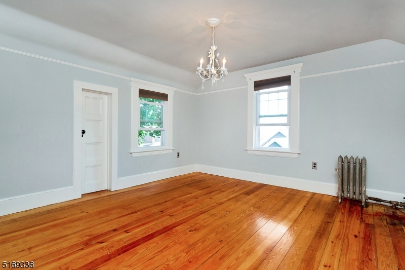 62 Crane Street Caldwell, NJ 07006 - Photo 14 of 28 a view of empty room with wooden floor and fan