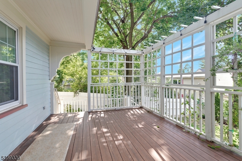 62 Crane Street Caldwell, NJ 07006 - Photo 25 of 28 a view of a wooden deck with a large window