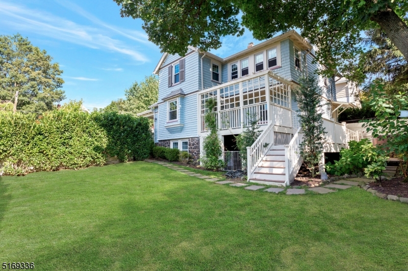 62 Crane Street Caldwell, NJ 07006 - Photo 26 of 28 a front view of a house with a garden