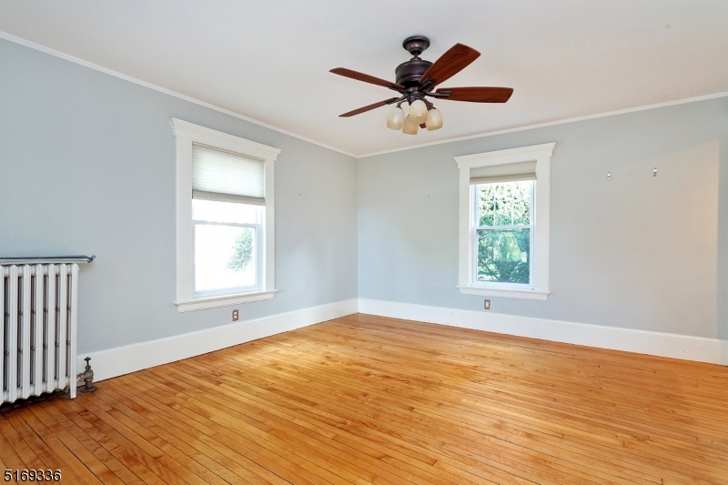 62 Crane Street Caldwell, NJ 07006 - Photo 3 of 28 a view of a room with wooden floor and a window