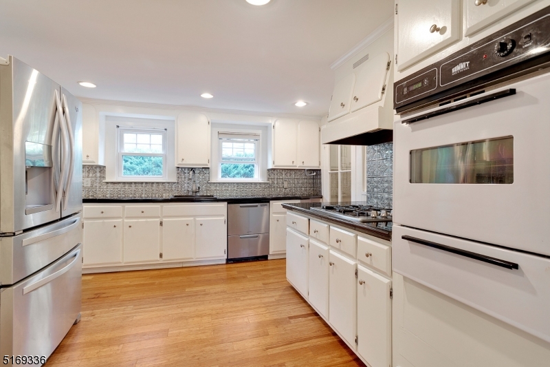 62 Crane Street Caldwell, NJ 07006 - Photo 9 of 28 a kitchen with stainless steel appliances granite countertop a stove and a sink