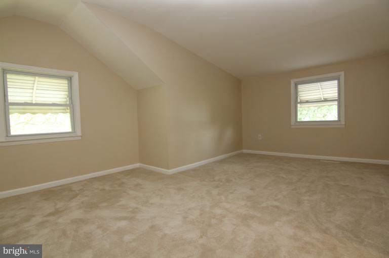 2038 Rolling Rd. Windsor Mill, MD 21244 - Photo 6 of 16 an empty room with a window