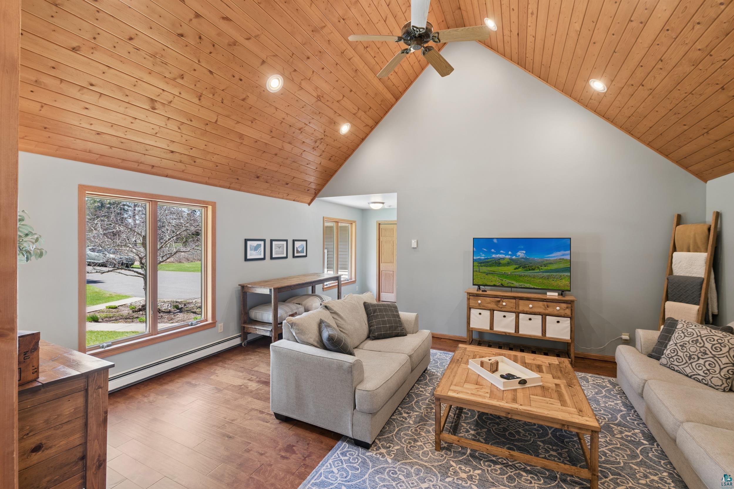 3113 Golf Course Road Ashland, WI 54806 - Photo 15 of 38 Vaulted wood-finish ceiling with recessed lighting and ceiling fan