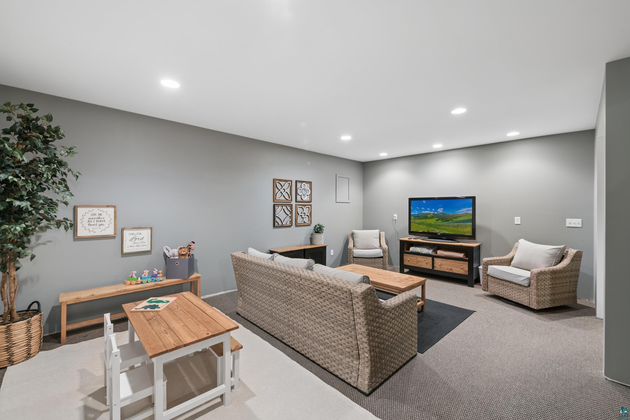 3113 Golf Course Road Ashland, WI 54806 - Photo 26 of 38 Spacious room featuring recessed lighting, a neutral gray wall color, and a combination of carpet and area rug flooring