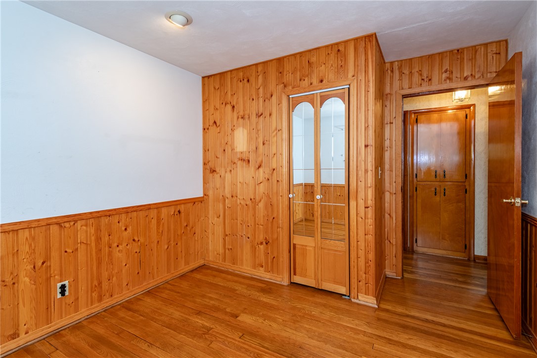 1176 Geneva Road Dayton, OH 45434 - Photo 22 of 55 This versatile room features warm wood paneling and hardwood floors.