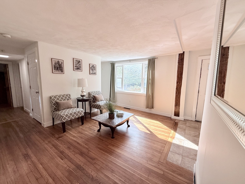 975 South Main Street Bellingham, MA 02019 - Photo 9 of 38 a living room with furniture and a large window