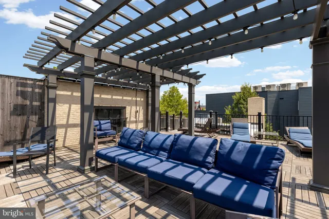 a outdoor living space with patio furniture and a fireplace