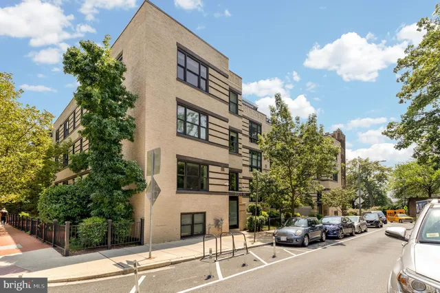 a view of a street with cars