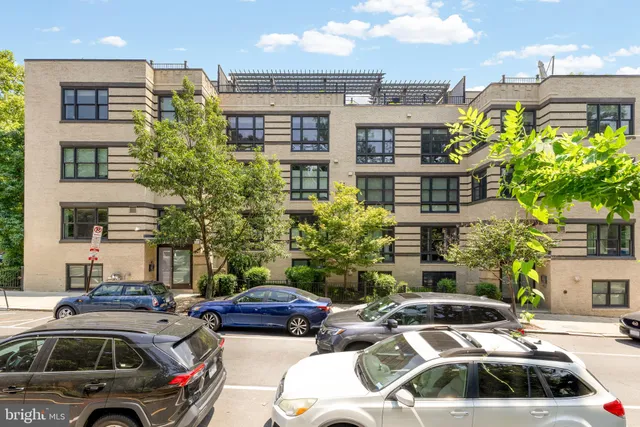 a view of cars parked in front of a building