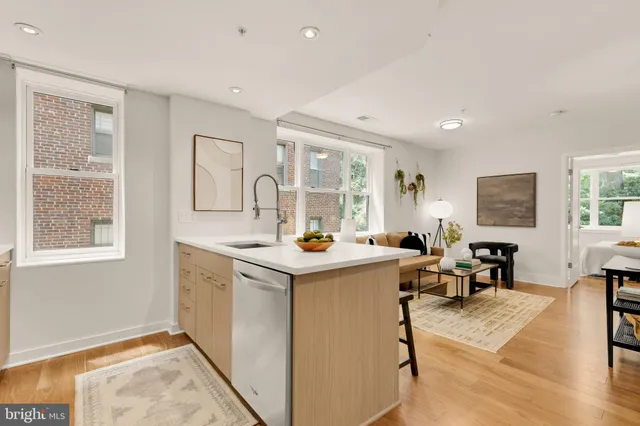 a view of living room with granite countertop furniture and fireplace