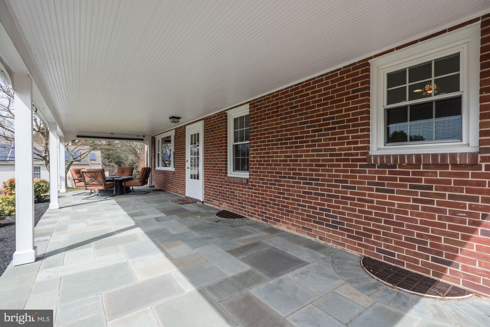10030 Reed Lane Ellicott City, MD 21042 - Photo 3 of 39 Covered Front Porch with Bluestone Tile