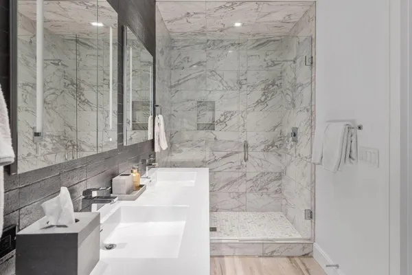 a bathroom with a bathtub and shower