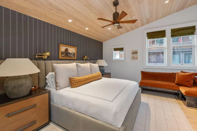 a en suite bathroom with a tub sink and mirror