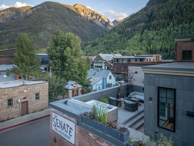 a view of house with outdoor space and sitting area