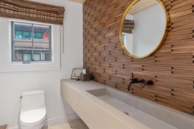 a bedroom with double bed and a couch