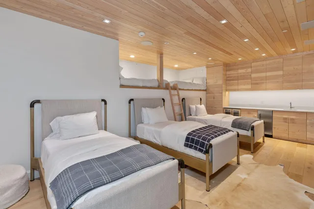 a bathroom with a white toilet and a picture of bathroom