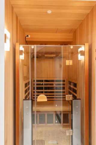 a work room with furniture and a wooden floor