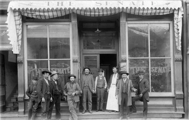 a front view of a house with a door and a porch