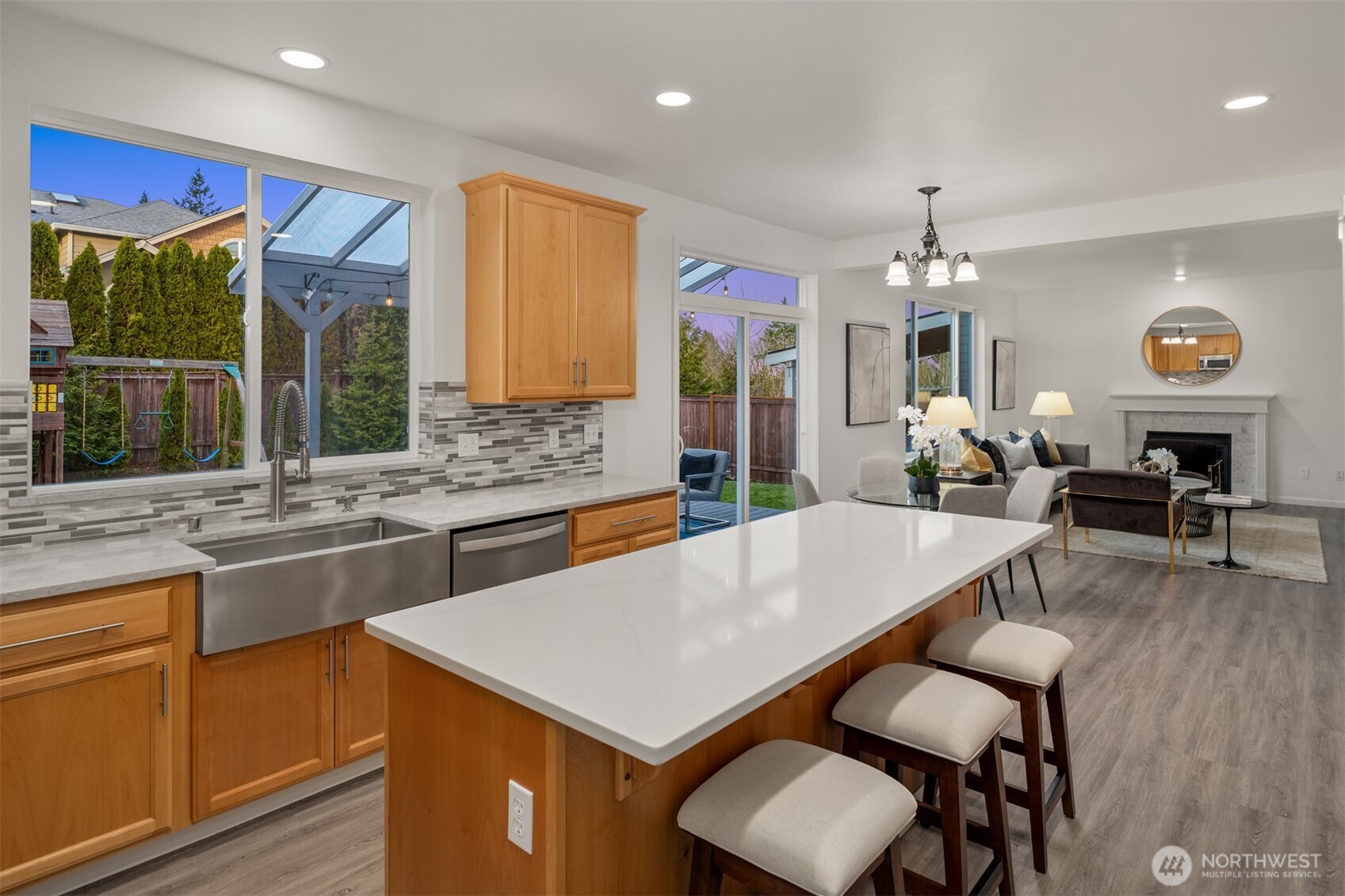 21120 Meridian Place West Bothell, WA 98021 - Photo 10 of 36 a kitchen with a table chairs sink and wooden floor