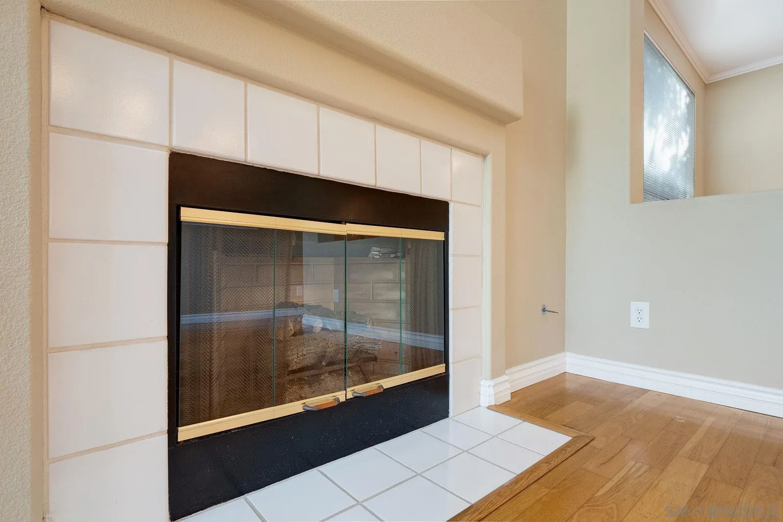 5512 Renaissance Avenue, Unit 3 San Diego, CA 92122 - Photo 14 of 57 a living room with a fireplace