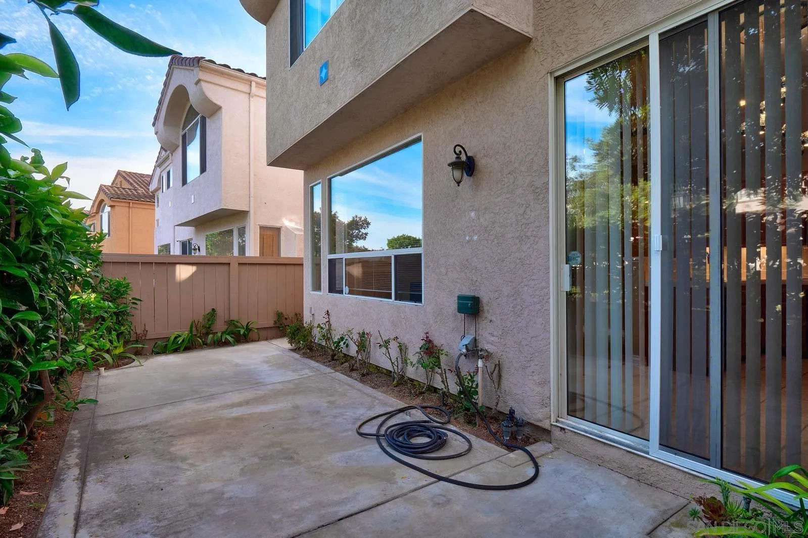 5512 Renaissance Avenue, Unit 3 San Diego, CA 92122 - Photo 22 of 57 a view of a porch with couches and potted plants